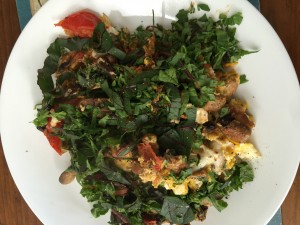 Not pretty! Home grown eggs, a fried tomato, old mushrooms found in the fridge with unwashed (important for microbiome?) silverbeet and roquet-gone-to-seed from the garden.